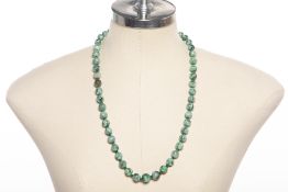 A JADE BEAD NECKLACE AND A PENDANT