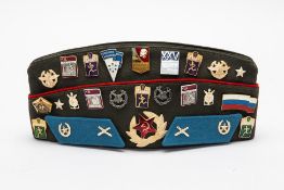 A SOVIET UNION MILITARY OFFICERS HAT AND PINS