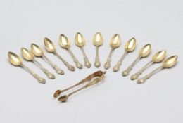 A SET OF TWELVE FRENCH SILVER TEA SPOONS AND TONGS