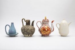 A GROUP OF FOUR VARIOUS EWERS / WINE POTS