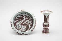 AN UNDERGLAZED COPPER RED GU SHAPED VASE AND A BOWL