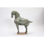 A TANG STYLE GREEN GLAZED MODEL OF A HORSE