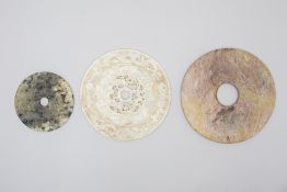 THREE CARVED ARCHAIC STYLE HARDSTONE/JADE DISKS