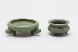 TWO CELADON GLAZED TRIPOD CENSERS