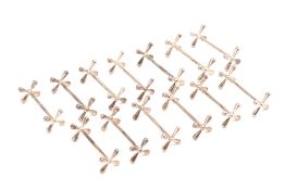 A SET OF THIRTEEN SILVER KNIFE RESTS