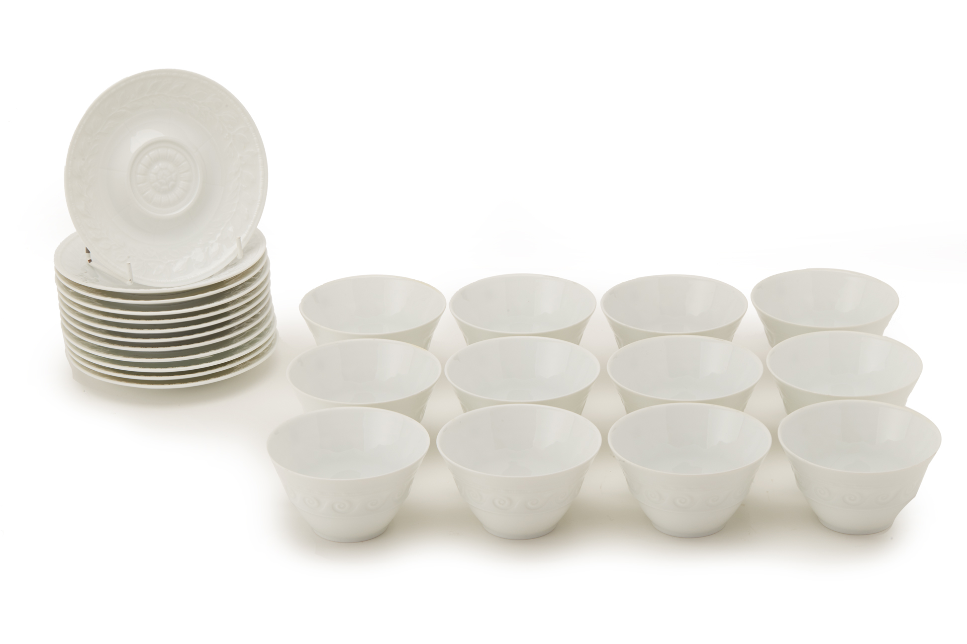 A SET OF BERNARDAUD LIMOGES 'LOUVRE' PATTERN TEA CUPS