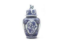 A LARGE DELFT BLUE AND WHITE VASE AND COVER