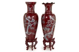 TWO LARGE RED LACQUER VASES ON STANDS