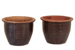 A LARGE PAIR OF TERRACOTTA POTS