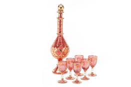 A LARGE RUBY GLASS DECANTER AND SIX GLASSES