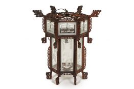 A LARGE ORIENTAL CARVED WOOD AND GLASS HANGING LANTERN