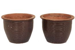 A LARGE PAIR OF TERRACOTTA POTS (3)