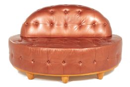 A TWO-SEATER LEATHER SOFA