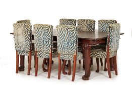 A TEAK DINING TABLE AND EIGHT BESPOKE DESIGNERS GUILD CHAIRS