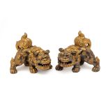 A PAIR OF ORIENTAL PORCELAIN MYTHICAL BEASTS