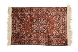 A SMALL SILK CARPET