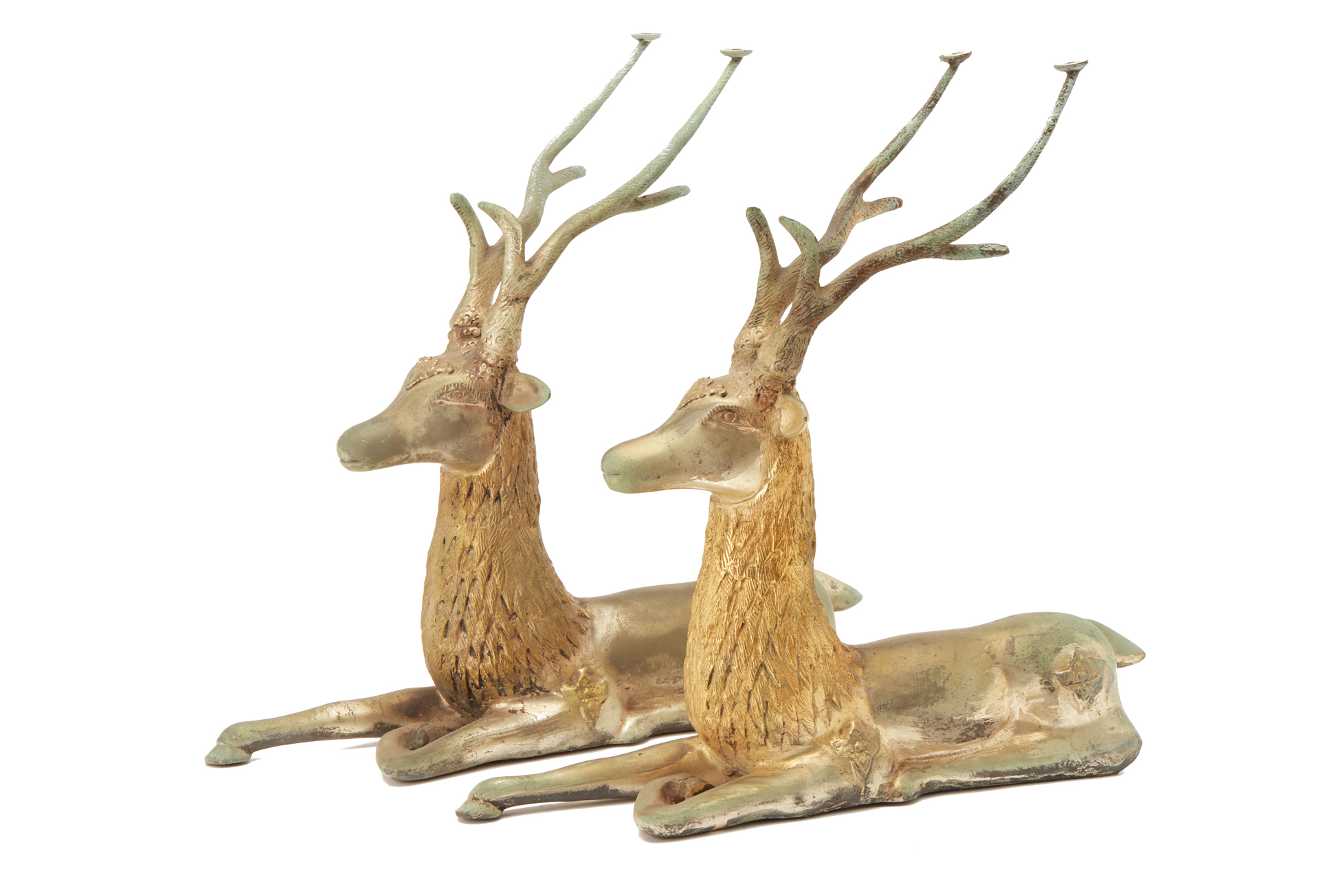 A PAIR OF METALWARE MODELS OF RECLINING STAGS