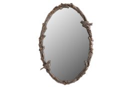 AN OVAL WALL MIRROR