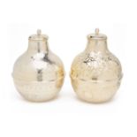 A PAIR OF WHITE METAL VESSELS