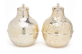 A PAIR OF WHITE METAL VESSELS