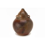 A BROWN GLAZED TWIN HANDLED DOUBLE GOURD VASE