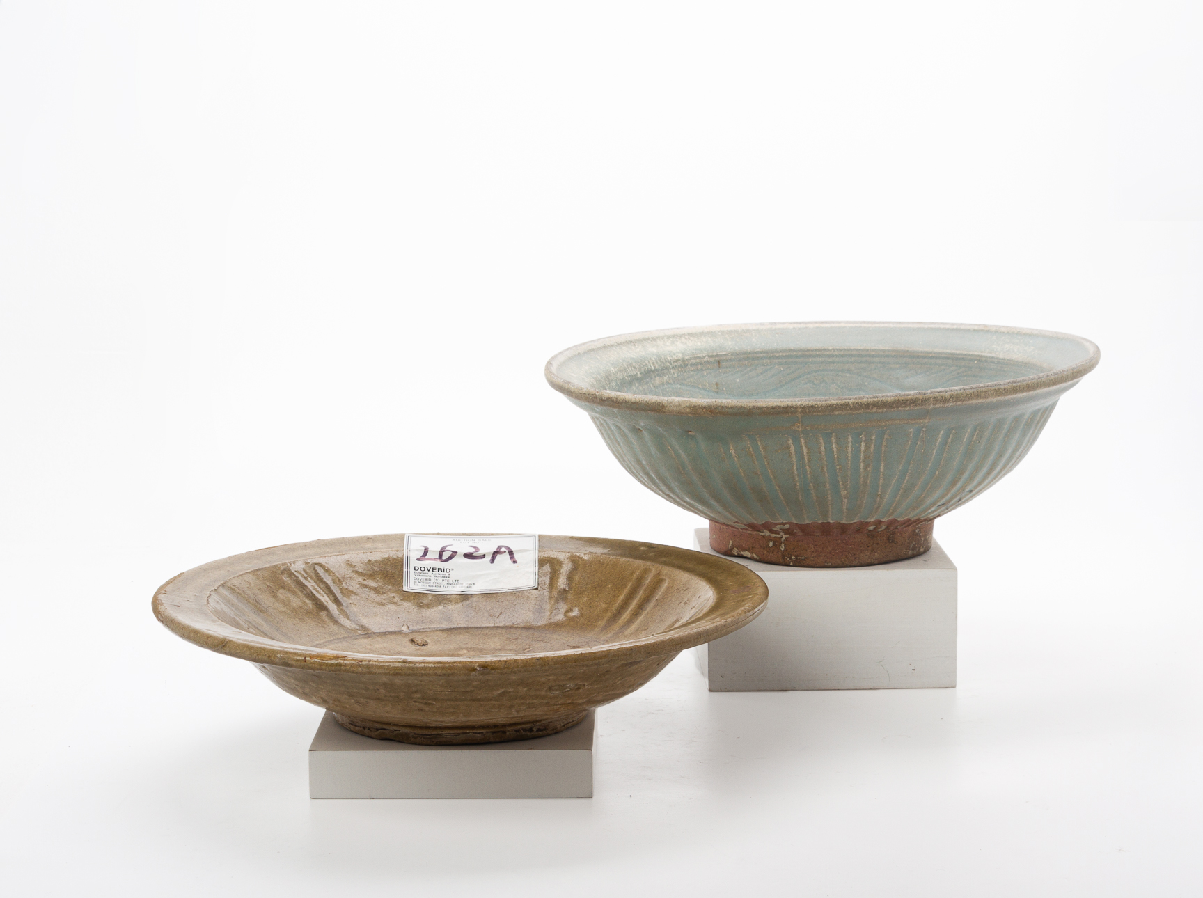 A CELADON GLAZED BOWL AND DISH