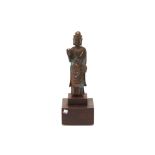 A BRONZE STANDING FIGURE OF BUDDHA