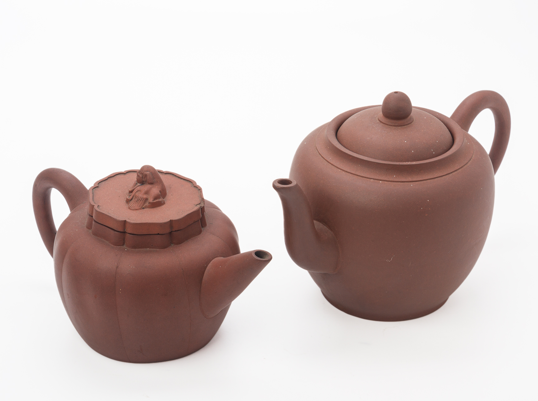 TWO YIXING POTTERY TEAPOTS