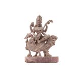 AN INDIAN CARVED STONE FIGURE OF SARASWATI