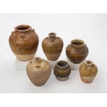 A GROUP OF SIX POTTERY JARS