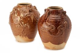 TWO SIMILAR BROWN GLAZED STORAGE JARS