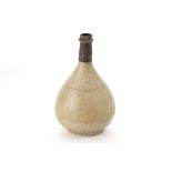 A CELADON GLAZED PEAR SHAPED BOTTLE VASE