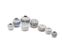 A GROUP OF SMALL VIETNAMESE BLUE AND WHITE JARS AND BOXES
