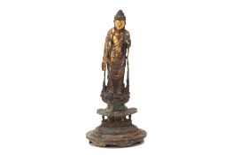 A GILT BRONZE STANDING BUDDHA FIGURE