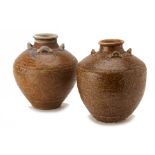 TWO INCISED GREEN-BROWN GLAZED STORAGE JARS