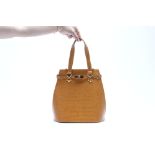 A CROCODILE LEATHER HANDBAG