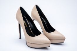 A PAIR OF YVES SAINT LAURENT BEIGE PLATFORM HEELS EU 36