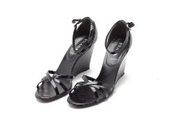 A PAIR OF PRADA BLACK PATENT LEATHER WEDGES EU 40