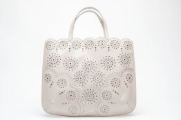 AN ALAÏA SILVER TONE STUDDED TOTE BAG