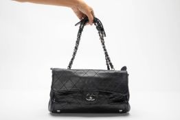 A CHANEL BLACK QUILTED LEATHER RITZ FLAP BAG