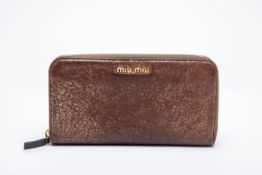 A MIU MIU LEATHER ZIP AROUND WALLET