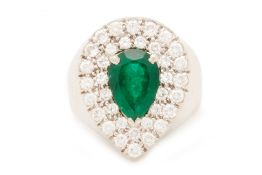 A PEAR CUT EMERALD AND DIAMOND RING