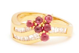 A CABOCHON RUBY AND DIAMOND RING