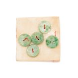 A GROUP OF FIVE JADE BUTTONS