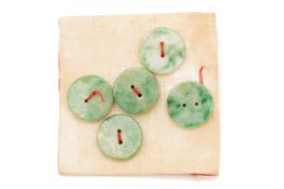 A GROUP OF FIVE JADE BUTTONS