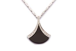 AN ONYX AND DIAMOND PENDANT NECKLACE