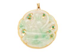 A CARVED JADE AND EMERALD PENDANT