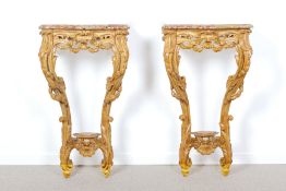 A PAIR OF ROCOCO MARBLE TOPPED CARVED WOOD CONSOLE TABLES