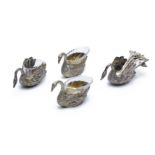 A SET OF FOUR GERMAN SILVER SWAN SALT CELLARS AND SPOONS