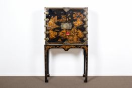 A BRASS MOUNTED BLACK JAPANNED CABINET ON STAND